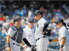  ?? Kathy Willens ?? The Associated Press Yankees reliever Dellin Betances, center, stands on the mound after allowing the go-ahead run in the eighth inning against the Blue Jays.