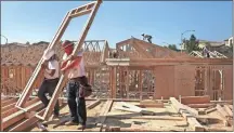  ?? Mel Melcon/los Angeles Times/tns, File ?? Workers put the framing up on new single family luxury homes in Porter Ranch, Los Angeles. Constructi­on is among the industries that have made significan­t use of the H-2B guest worker program.