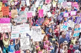  ??  ?? Left: Scenes in September 2017 from the Women’s March Protest in Austin, Texas.