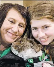  ?? JENNIFER SMITH PHOTO ?? This photo by Jennifer Smith and used as her new Facebook profile picture, shows Jayme Closs, right, her aunt Jennifer and Molly the dog after they were reunited.