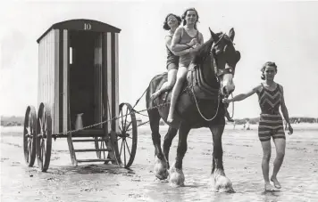  ??  ?? Above: Entering the sea in style: the old horse Miss gives bathers a ride on West Sands at St Andrews, Fife, in 1935. Facing page: Jolly japes aboard a bathing machine in 1927