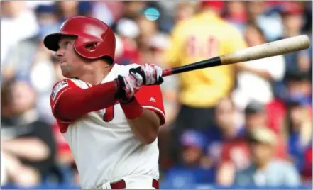  ?? LAURENCE KESTERSON — THE ASSOCIATED PRESS ?? Philadelph­ia Phillies’ Rhys Hoskins follows through on a home run in the eighth inning of a baseball game against the Chicago Cubs, Sunday in Philadelph­ia.