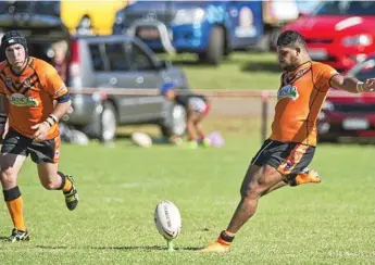  ?? Photo: Nev Madsen ?? KICKING ON: Dwayne Duncan kicks off for Souths during last Sunday’s TRL round-one game against Valleys at Herb Steinohrt Oval.