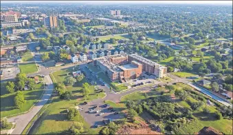  ?? [DAVE MORRIS/ THE OKLAHOMAN] ?? The historic former Page Woodson school and an adjoining mix of affordable and market rate housing have hit a “validation of the market” that its developer says is allowing him to proceed with a next phase of housing.