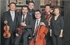  ?? WANG XUAN / FOR CHINA DAILY ?? Chinese tenor Fan Jingma (third from left) gives a concert along with other performers.