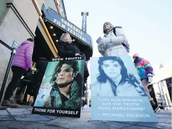  ?? DANNY MOLOSHOK/THE ASSOCIATED PRESS ?? Brenda Jenkyns, left, and Catherine Van Tighem drove to Utah from Calgary to protest at the première of the Leaving Neverland documentar­y during the Sundance Film Festival.