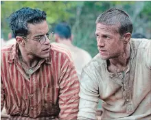  ?? JOSE HARO THE ASSOCIATED PRESS ?? Rami Malek, left, and Charlie Hunnam in a scene from “Papillon,” which is showing at the Film House at FirstOntar­io Performing Arts Centre.