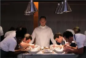  ?? ?? Chef Slowik (Ralph Fiennes) presides over a last supper in “The Menu,” which came in at No. 2 with $9 million in U.S. and Canadian theaters.