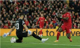  ?? Tom Jenkins/The Guardian ?? Sadio Mané doubles Liverpool’s lead over Villarreal in the second half at Anfield. Photograph: