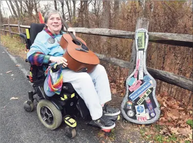  ?? Arnold Gold / Hearst Connecticu­t Media ?? Disability rights activist and singer/songwriter Elaine Kolb outside her home in West Haven on Friday.