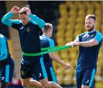  ?? ?? Nicky Devlin, right, gets to grips with preseason training at Livingston