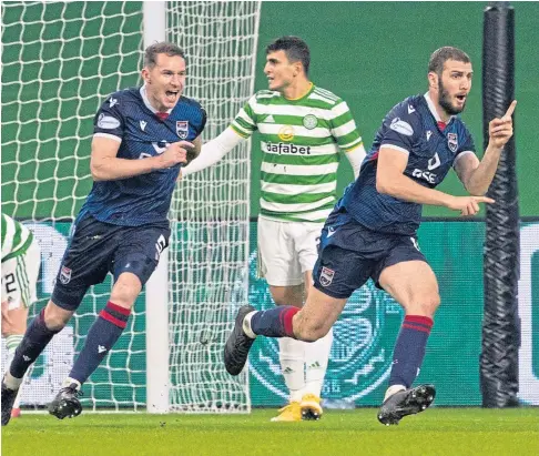  ??  ?? CUP-TIE CLINCHER: Alex Iacovitti races away to celebrate after his late goal sealed a memorable win at Celtic Park.