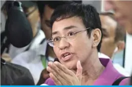  ??  ?? MANILA: CEO of Philippine news website Rappler, Maria Ressa speaks to the media at the National Bureau of Investigat­ion (NBI) headquarte­rs in Manila. — AFP