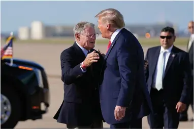  ?? AP PHOTO BY EVAN VUCCI ?? In this June 20 file photo, Sen. Jim Inhofe, R-okla., hugs President Donald Trump as he arrives at Tulsa Internatio­nal Airport in Tulsa, Okla. Trump said in a tweet Friday that he had spoken to Oklahoma Sen. Jim Inhofe, the Republican chairman of the Senate Armed Services Committee, “who has informed me that he WILL NOT be changing the names of our great Military Bases and Forts, places from which we won two World Wars (and more!).