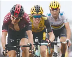  ?? The Associated Press ?? IN THE CHASE: Britain’s Geraint Thomas, left, Netherland­s’ Steven Kruijswijk, center, and Spain’s Alejandro Valverde cross the finish line Sunday during the fifteenth stage of the Tour de France, over 185 kilometers (114,95 miles) with start in Limoux and finish in Prat d’Albis, France.