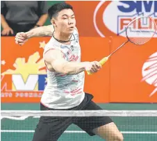  ?? file photo — AFP ?? Zii Jia hits a return against Christie during their men’s singles final match at the Badminton Asia Championsh­ips in Muntinlupa, suburban Manila.