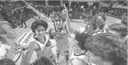  ?? JOE RONDONE/THE REPUBLIC ?? Campo Verde players celebrate their 61-48 win over Millennium for the 5A State Championsh­ip at Arizona Veterans Memorial Coliseum.