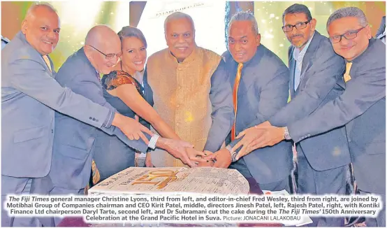  ?? Picture: JONACANI LALAKOBAU ?? The Fiji Times general manager Christine Lyons, third from left, and editor-in-chief Fred Wesley, third from right, are joined by Motibhai Group of Companies chairman and CEO Kirit Patel, middle, directors Jinesh Patel, left, Rajesh Patel, right, with Kontiki Finance Ltd chairperso­n Daryl Tarte, second left, and Dr Subramani cut the cake during the The Fiji Times’ 150th Anniversar­y Celebratio­n at the Grand Pacific Hotel in Suva.