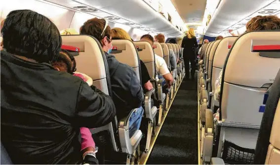  ?? Joe Amarante / Hearst Connecticu­t Media ?? The days of empty airports and planes may be over. Flight attendants’ advice: Exercise safety protocols, patience and kindness.