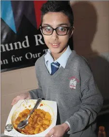  ??  ?? Hamza Yasin showcasing the foods of Pakistan durin Culture Week in St. Josephs. Inset, right: Michelle Linkeviciu­s and her son Domo at the Culture Week food event in St. Josephs.