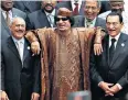  ??  ?? Top, Houthi rebels celebrate the demise of Yemen’s former leader Ali Abdullah Saleh, pictured above in 2010 with Muammar Gaddafi of Libya and Egypt’s Hosni Mubarak