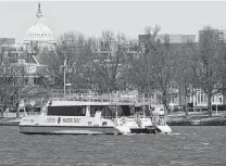  ?? Associated Press file photo ?? A water taxi moves in the Washington Channel next to Fort Mcnair in Washington, D.C., with the U.S. Capitol in the back.