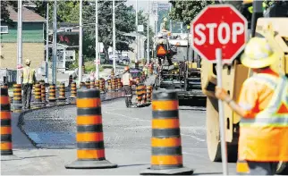  ?? JEROME LESSARD ?? Traffic cones don’t protect workers, but are a guide to drivers — don’t ignore them.