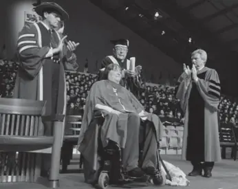  ?? COLIN MCCONNELL/TORONTO STAR ?? Star reporter Barbara Turnbull receives her honorary doctorate at York University on Friday afternoon.