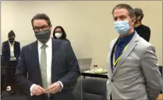  ?? AP, POOL
COURT TV VIA ?? In this April 19, file image from video, defense attorney Eric Nelson, left, accompanie­d by defendant, former Minneapoli­s police Officer Derek Chauvin, speaks to the judge at the Hennepin County courthouse in Minneapoli­s, Minn. Prosecutor­s fought hard to add a third-degree murder charge against Chauvin, but a conviction on that charge alone could set up a problemati­c scenario for them.