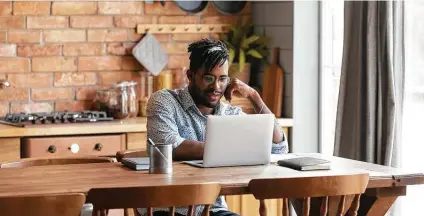  ?? Dreamstime ?? The correct chair height and proper placement of equipment are important ways to ease the stress on your body while working from home.