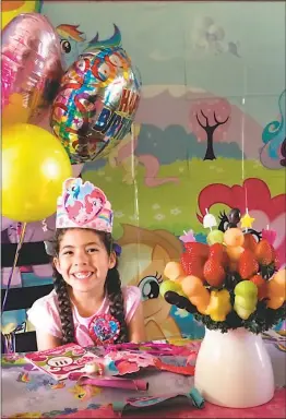  ?? SUBMITTED PHOTOS ?? Addison Taylor, 6, is pictured with her “cake” made up of fruit on her sixth birthday. Addison’s family, along with FGS, LLC, will host an event to raise funds and awareness for Prader-Willi Syndrome research in August.