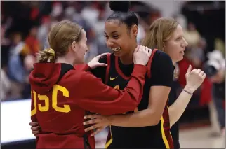  ?? JOSIE LEPE — THE ASSOCIATED PRESS ?? USC's JuJu Watkins, all smiles, rejoices with India Otto, left, after scoring a school-record 51points Friday.