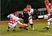  ??  ?? Arcata’s Ty Franklin makes a first down before being taken down by Ferndale defender Garrett Christians­en.