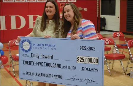  ?? (Special to The Commercial/Richard Ledbetter) ?? Gov. Sarah Huckabee Sanders and Drew Central educator Emily Howard proudly display the Milken Educator Award financial prize during a presentati­on Thursday at the Drew Central High School gymnasium.