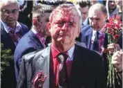  ?? PHOTO: TWITTER ?? Protesters in Poland doused Russian Ambassador Sergei Andreyev with red paint as he attempted to lay flowers at a Soviet military memorial cemetery in Warsaw for Red Army soldiers who died during World War II