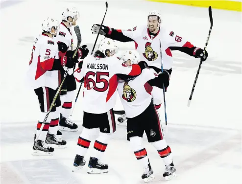  ?? FRANK FRANKLIN II / THE ASSOCIATED PRESS ?? Captain Erik Karlsson and his Senators teammates celebrate in the third period of Tuesday’s game against the New York Rangers. Ottawa is trying to become the first Canadian team to win the Stanley Cup since 1992-93.