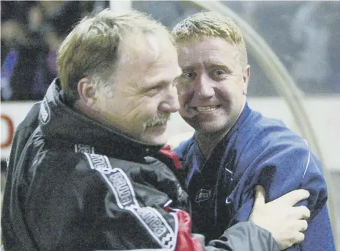  ??  ?? 0 John Robertson celebrates with No2 Donald Park after his Inverness side defeated Celtic in the Scottish Cup quarter-finals in 2003.