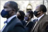  ?? ASSOCIATED PRESS FILE PHOTO ?? Georgia
State Rep. Park Cannon, D-Atlanta, center, walks beside Martin Luther King III as she returns to the State Capitol in Atlanta.