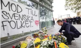  ?? Belga/AFP/Getty Images ?? The Swedish PM, Ulf Kristersso­n, lays a wreath during a commemorat­ion for the two Swedish men killed in a terror attack in Brussels on Tuesday. Photograph: Benoît Doppagne/