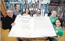  ?? JASON BAIN EXAMINER ?? Launching the Peterborou­gh Downtown Business Improvemen­t Area’s (BIA) Holiday Shopping Passport program at Wild Rock Outfitters are, from left, Terry Guiel and Joel Wiebe of the BIA, Theresa Foley of Showplace Performanc­e Centre, Jonathan Moreno from Wild Rock and James and Lena Wallwork from Liftlock Lock Escape on Monday.