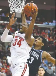  ?? AP/JAY LAPRETE ?? Ohio State’s Kaleb Wesson (left) shoots in front of Villanova’s Jermaine Samuels during the second half of an NCAA college basketball game Wednesday in Columbus, Ohio.