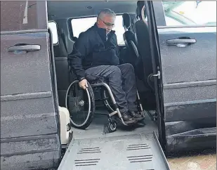  ?? RHONDA HAYWARD/THE TELEGRAM ?? Retired RNC Const. Aiden Kenny manoeuvres his chair in a new wheelchair accessible van. A car accident in 1987 left Kenny paralyzed from the chest down.