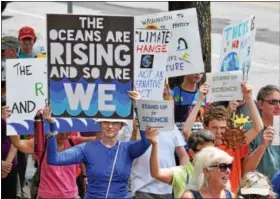  ?? MARIAN DENNIS — DIGITAL FIRST MEDIA ?? Participan­ts brought homemade signs to a rally on High Street Saturday to show their desire for change in environmen­tal regulation­s.