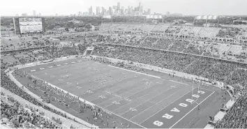  ?? Thomas B. Shea ?? The Cougars football team is on the rise, with sales of season tickets for games at TDECU Stadium at 21,000 and increasing. The Cougars open at home against Oklahoma, a member of the Big 12, on Sept. 3.