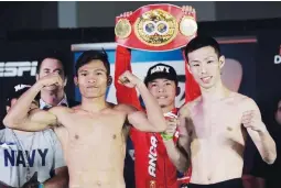  ??  ?? Jerwin Ancajas and Japanese challenger Ryuichi Funai pose after Friday’s weigh-in in Stockton, California. Ancajas is set to defend his IBF super flyweight crown today. (Alvin Go)