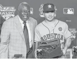  ?? Brett Coomer / Houston Chronicle ?? Hank Aaron, left, said Wednesday of Jose Altuve: “There’s not many people I would pay to go see, but I’ll tell you, I would pay to go see him.”