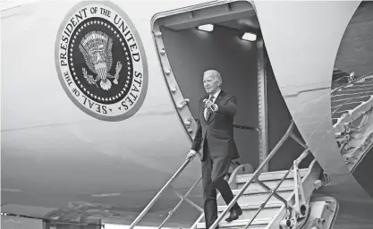  ?? MANDEL NGAN/AFP VIA GETTY IMAGES ?? President Joe Biden leaves Air Force One at the Boston airport. He was set to attend campaign receptions in the area.