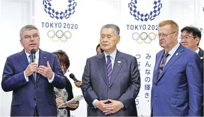  ??  ?? TOKYO: Internatio­nal Olympic Committee (IOC) President Thomas Bach (L) answers questions beside President of the 2020 Tokyo Olympics Organizing Committee (Tokyo 2020) Yoshiro Mori (C) and IOC Vice President John Coates (R) during a press conference at...