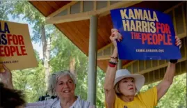  ?? Hilary Swift/ The New York Times ?? Supporters of Sen. Kamala Harris, D- Calif., hold signs on July 3 at the West Des Moines Democrats Fourth of July summer picnic in Des Moines, Iowa.