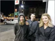  ?? ELIZABETH ROBERTSON /THE PHILADELPH­IA INQUIRER VIA AP, FILE) /THE PHILADELPH­IA INQUIRER VIA AP ?? In this 2017 file photo, Johnny Bobbitt Jr., left, Kate McClure, right, and McClure’s boyfriend Mark D’Amico pose at a Citgo station in Philadelph­ia.